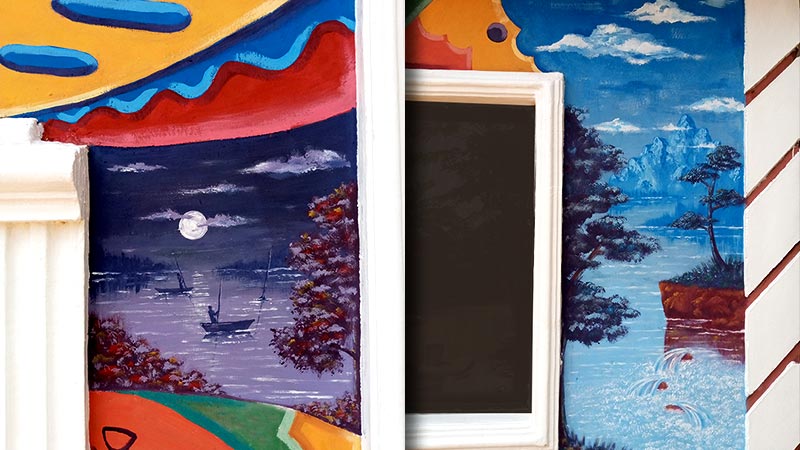 Victor Nwokoye outdoor mural on wall with blue themed landscape painting